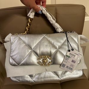 Brand new with tags still attached Chanel 19 medium size silver leather